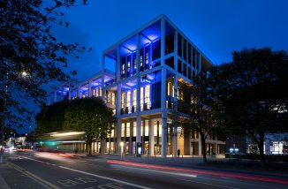 Town House lit up in blue during the RIBA Stirling Prize ceremony