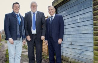 EYG’s Managing Director Nick Ward, now-retired director Chris George, and founder Jim Bingham, outside the garage where the business started in Hessle, east Yorkshire