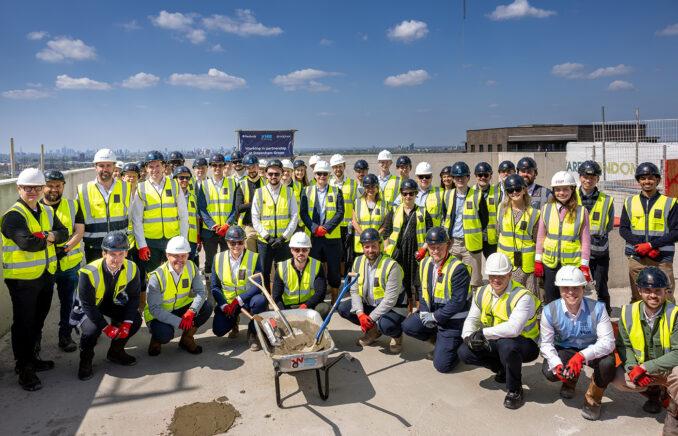 The partners came together to celebrate construction reaching its highest point on the tallest of three BTR residential buildings at the development.